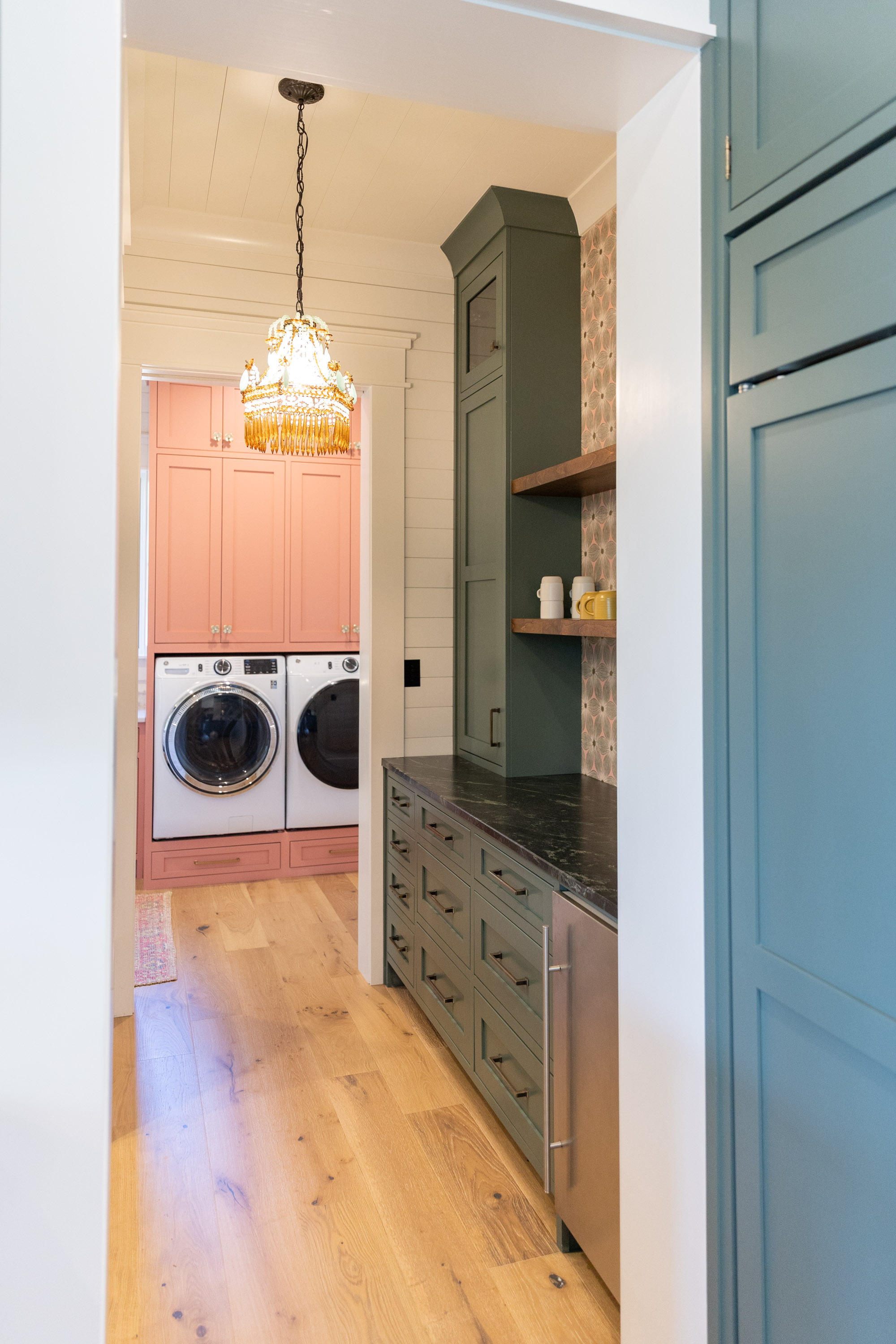 Designer mudroom and laundry room with blush pink and sage green cabinetry and shiplap walls — Mac & Morgan Interiors, Upstate SC